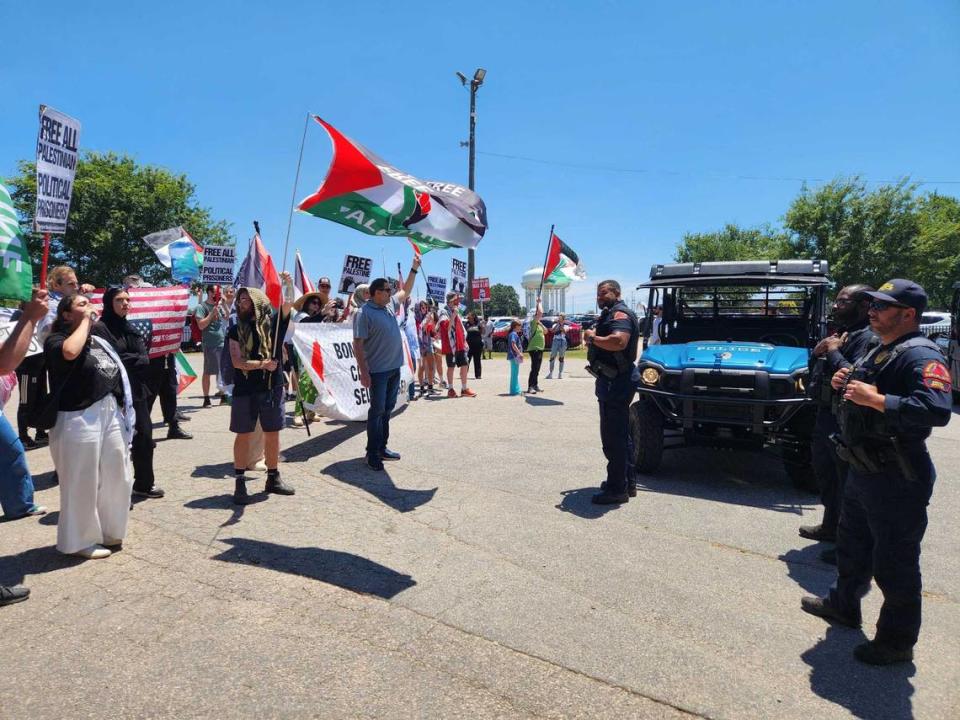 Protesters opposing President Joe Biden’s military support for Israel’s war against Hamas in Gaza chant at city police officers in front of a state fairgrounds gate in Raleigh. “We are the red line, Gaza’s the red line,” they repeated.