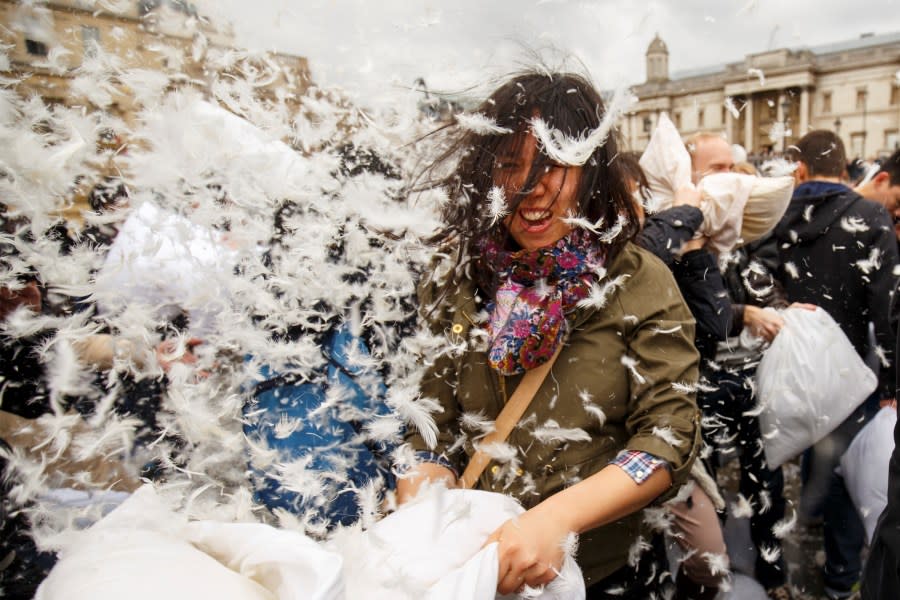 Revelers take part in a giant pillow fight in Trafalgar Square on ‘International Pillow Fight Day’ on April 4, 2015, in London, England. (Photo by Tolga Akmen/Anadolu Agency/Getty Images)