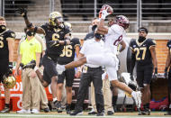 Virginia Tech wide receiver Tayvion Robinson (83) catches a pass over defense from Wake Forest defensive back Ja'Sir Taylor (6) during an NCAA college football game on Saturday, Oct. 24, 2020 at Truist Field in Winston-Salem, N.C. (Andrew Dye/The Winston-Salem Journal via AP)