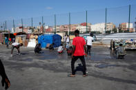 African migrants gather near a makeshift home on the outskirts of Casablanca, Morocco September 5, 2018. REUTERS/Youssef Boudlal