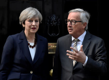 Britain's Prime Minister Theresa May welcomes Head of the European Commission, President Jean-Claude Juncker to Downing Street in London, Britain April 26, 2017. REUTERS/Hannah McKay