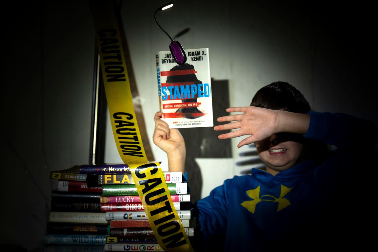 A photo illustration featuring books that were challenged in Greater Cincinnati and Northern Kentucky public schools over the 2022-23 school year.