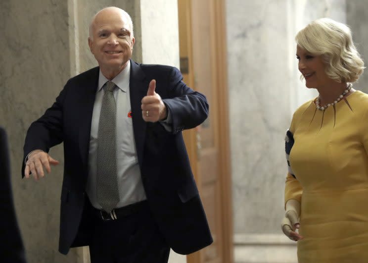 Sen. John McCain (L) (R-AZ) returns to the U.S. Senate accompanied by his wife Cindy (R) July 25, 2017 in Washington. (Photo: Win McNamee/Getty Images)