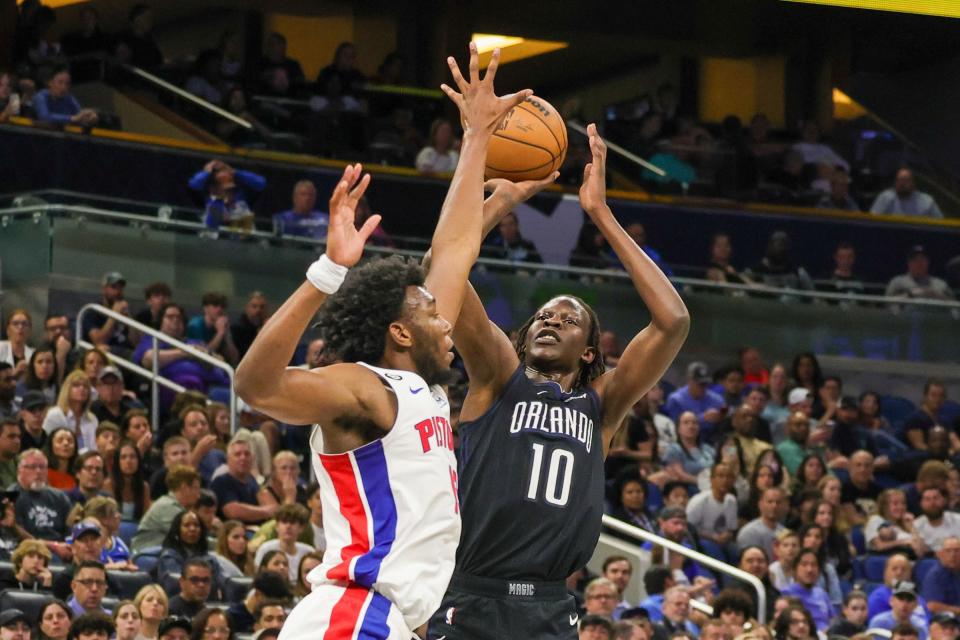 Magic center Bol Bol shoots the ball over Pistons center James Wiseman during the second quarter on Feb. 23, 2023, in Orlando, Florida.