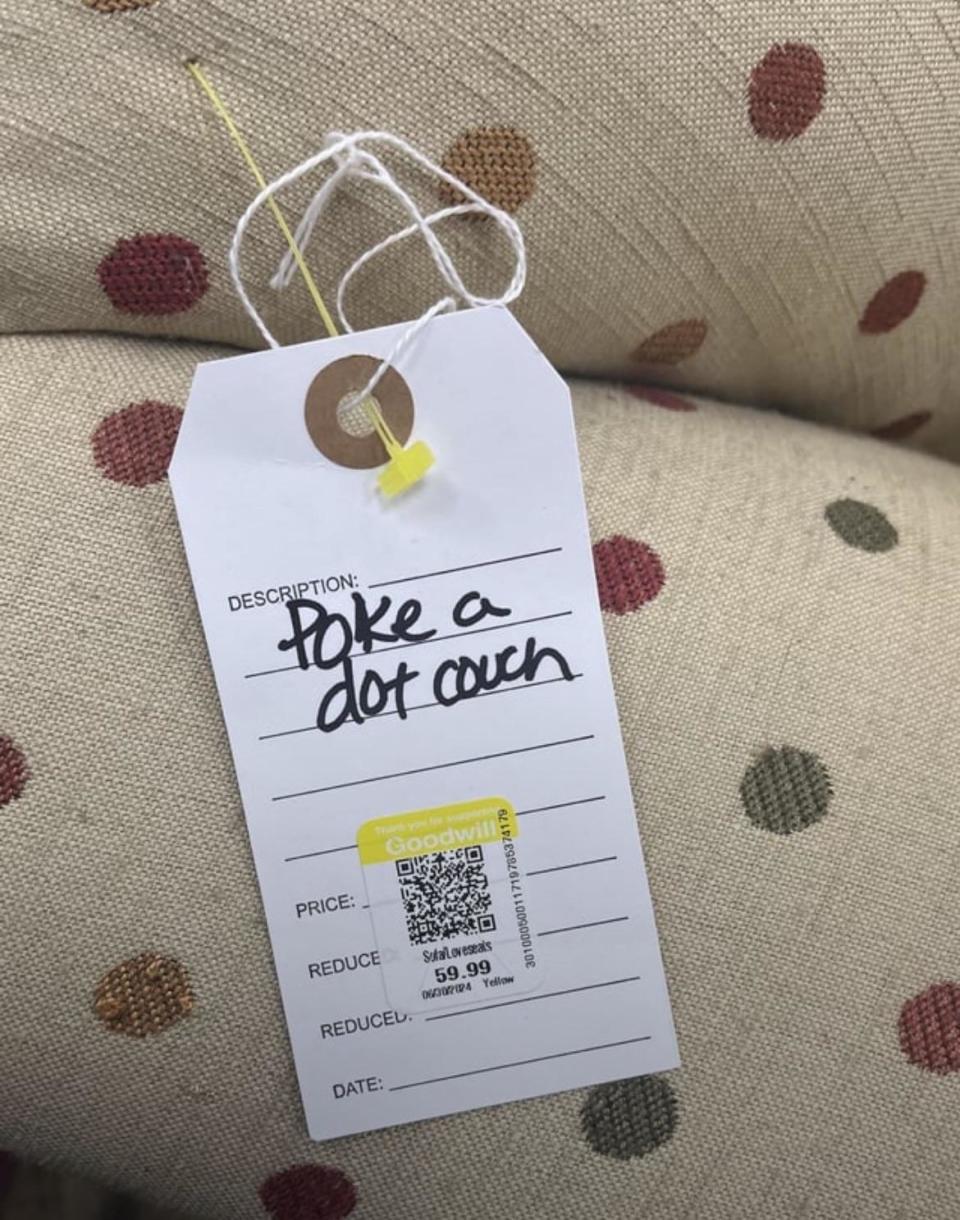 Price tag for a dotted couch at Goodwill with a handwritten description "Poke a dot couch". Price is reduced to $59.99