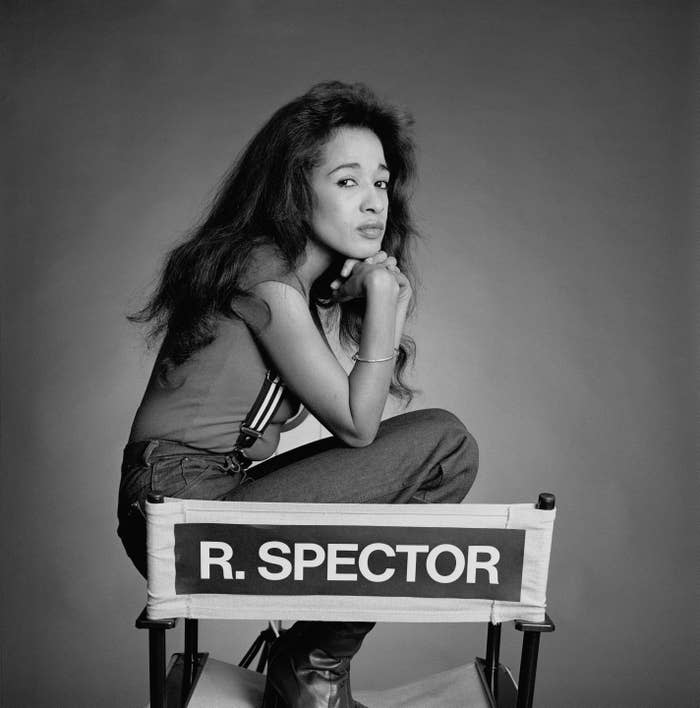 Spector sits on a director's chair with her name on it