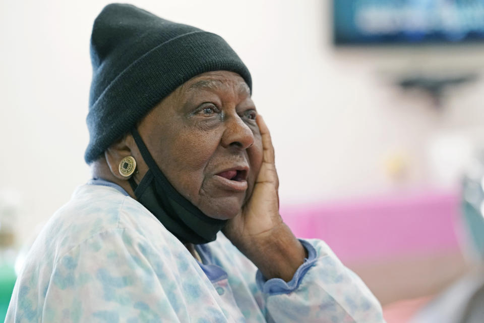 FILE - P.M. Browner, 88, speaks about her apprehension over receiving the COVID-19 vaccine, while waiting for a transportation bus at the Rev. S.L.A. Jones Activity Center for the Elderly to take her and other seniors to the Aaron E. Henry Community Health Service Center to receive a vaccination, in Clarksdale, Miss., in this April 7, 2021, file photo. New COVID-19 cases are declining across the most of the country, even in some states with vaccine-hesitant populations. But almost all states bucking that trend have lower-than-average vaccination rates, and experts warn that relief from the pandemic could be fleeting in regions where few people get inoculated. (AP Photo/Rogelio V. Solis, File)