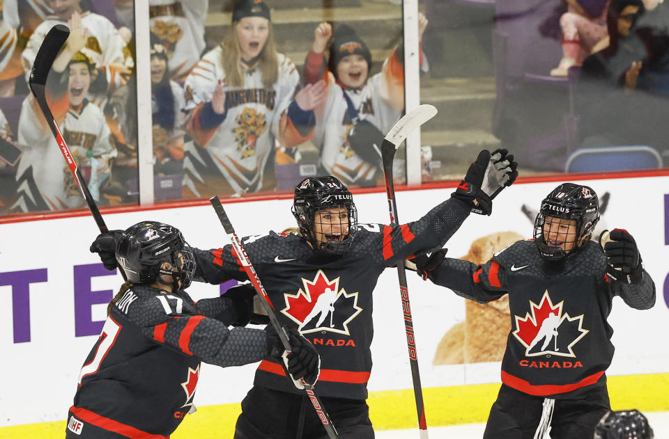 Canada forward Natalie Spooner (24) celebrates her goal with Canada defender Ella Shelton (17) and Canada forward Sarah Fillier (10). Team Canada takes on Team Switzerland on Day One of the IIHF Womens hockey tournament at the CAA Centre in Brampton.  (Toronto Star via Getty Images)