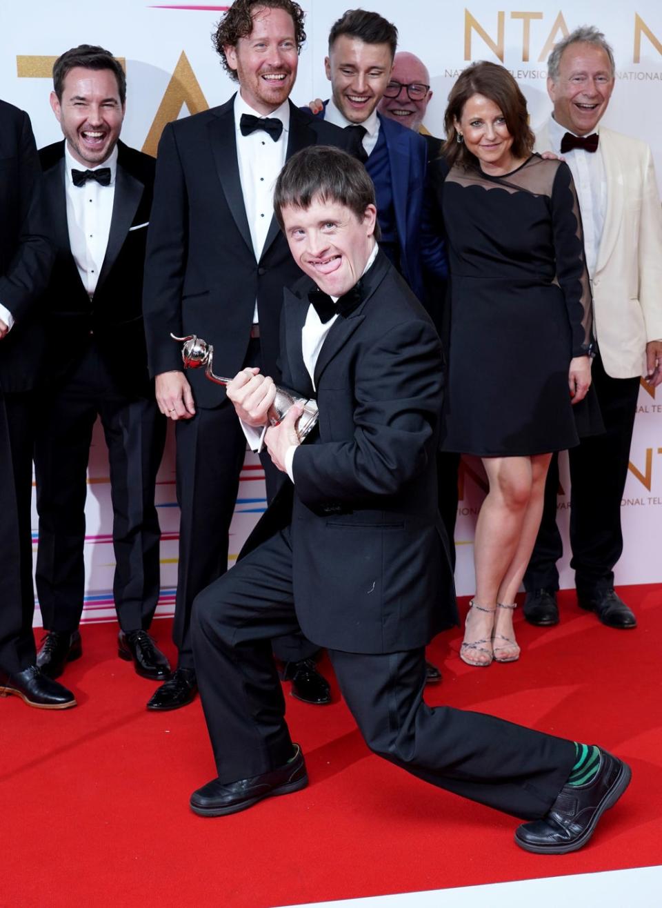 Tommy Jessop celebrates in the awards room with the cast and crew of Line of Duty (PA)