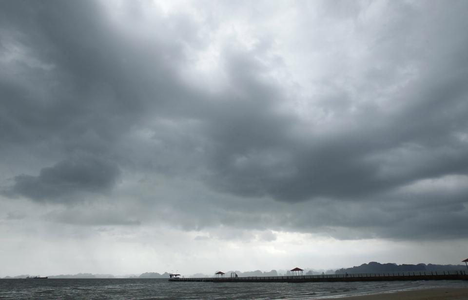 Storm clouds gather in the sky at Ha Long Bay in the aftermath of typhoon Haiyan in Quang Ninh province