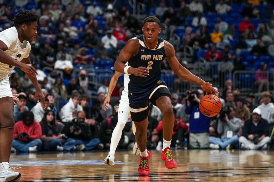 Stony Point senior Josiah Moseley handles the ball during the Tigers' 53-41 loss to Plano East in the UIL Class 6A state championship game at the Alamodome Saturday. Moseley, who will play college ball at Villanova, finished with 18 points and 12 rebounds.