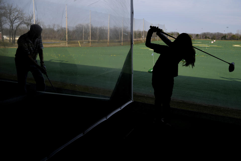 FILE - Golfers hit range balls during a warm day in Des Plaines, Ill., Feb. 27, 2024. Federal meteorologists on Friday, March 8, have made it official: It's the warmest U.S. winter on record by far. (AP Photo/Nam Y. Huh, File)