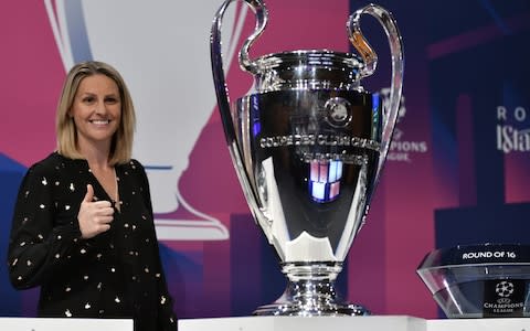 Kelly Smith with the CL trophy - Credit: AFP