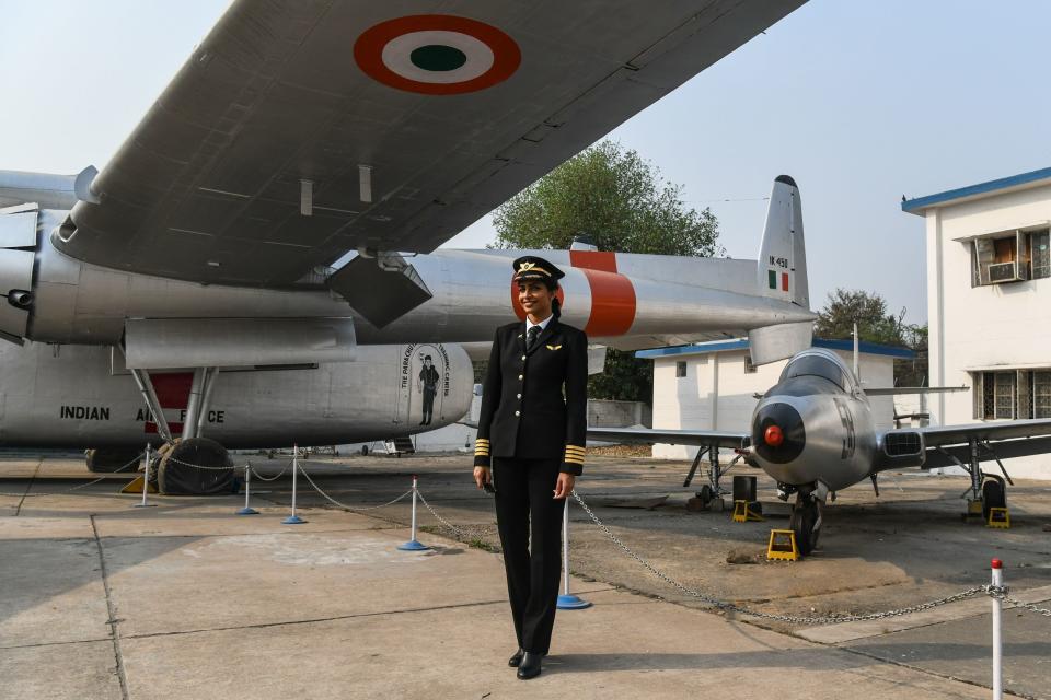 Anny Divya, 31, is a pilot who became the youngest woman in the world to captain the Boeing 777 aircraft. Here she poses next to planes at the Indian Air Force Museum in New Delhi on&nbsp;Feb. 24, 2018.