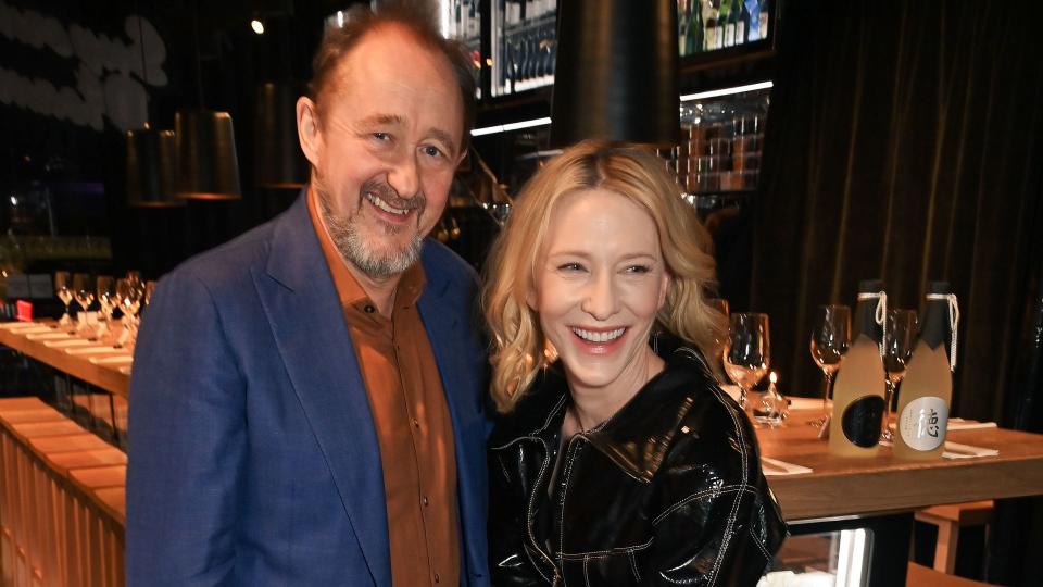 Cate smiling with her husband Andrew Upton 