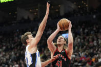 Orlando Magic forward Franz Wagner (22) defends against Toronto Raptors forward Kelly Olynyk (41) during the first half of an NBA basketball game Friday, March 15, 2024, in Toronto. (Frank Gunn/The Canadian Press via AP)