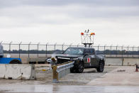 A 2022 Rivian R1T is used for a crash test research by the U.S. Army Corps of Engineers and Development Center and the University of Nebraska-Lincoln's Midwest Roadside Safety Facility on Oct. 12, 2023 in Lincoln, Neb. Preliminary tests point to concerns that the nation’s roadside guardrails are no match for new heavy electric vehicles. (Craig Chandler/University of Nebraska via AP)