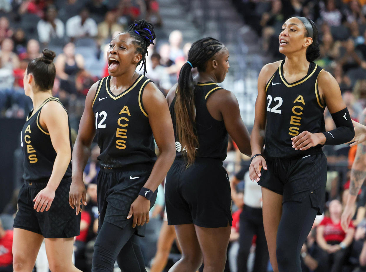 LAS VEGAS, NEVADA - SEPTEMBER 10: Kelsey Plum #10, Chelsea Gray #12, Jackie Young #0 and A'ja Wilson #22 of the Las Vegas Aces walk toward their bench during a timeout after Gray hit a 3-pointer against the Phoenix Mercury in the fourth quarter of their game at T-Mobile Arena on September 10, 2023 in Las Vegas, Nevada. The Aces defeated the Mercury 100-85. NOTE TO USER: User expressly acknowledges and agrees that, by downloading and or using this photograph, User is consenting to the terms and conditions of the Getty Images License Agreement. (Photo by Ethan Miller/Getty Images)