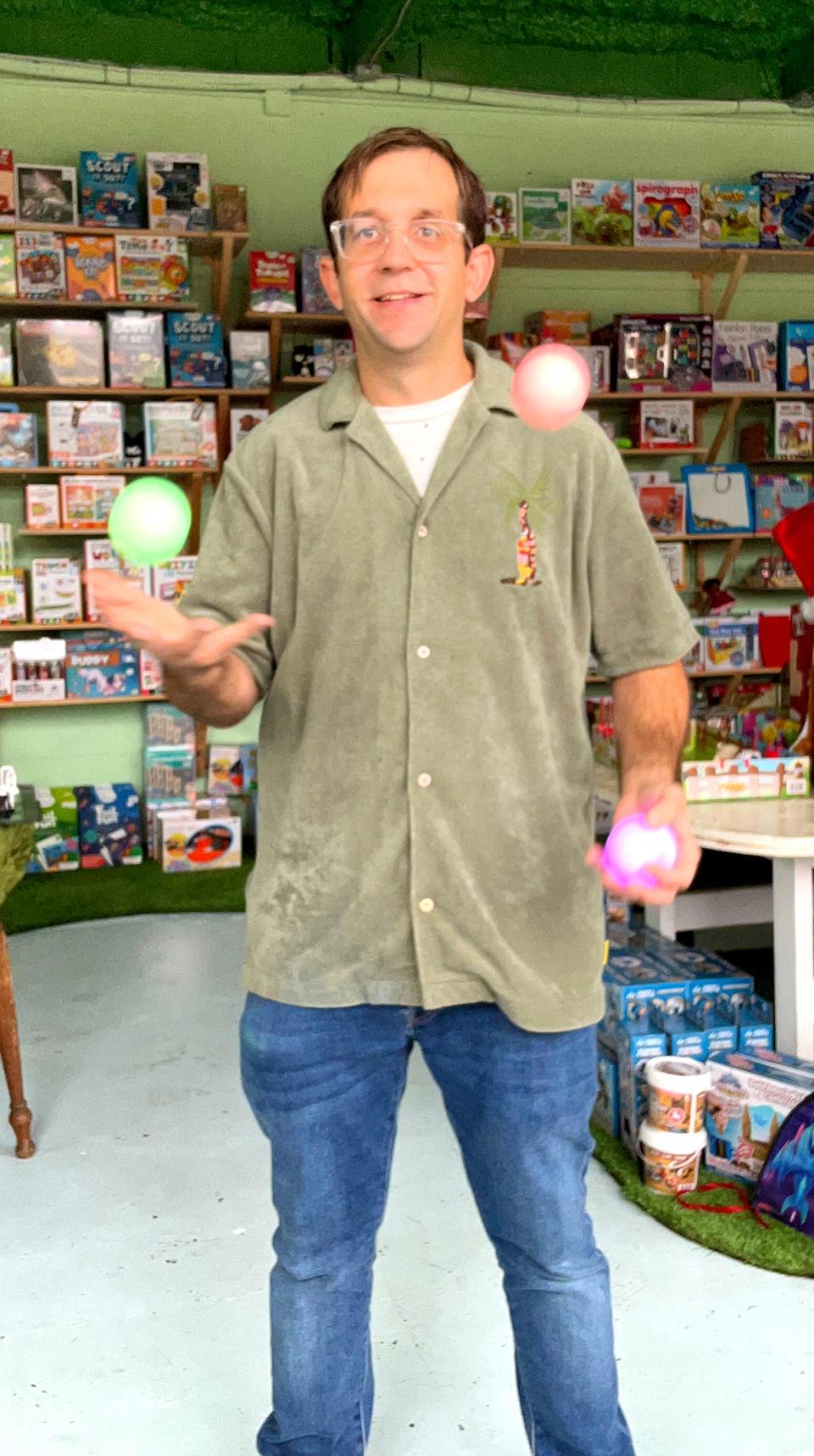 Owner of The Magical World of Toys Dante Pierson shows off his juggling skills