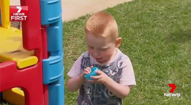 Sam and his beloved blue ball. Source: 7News