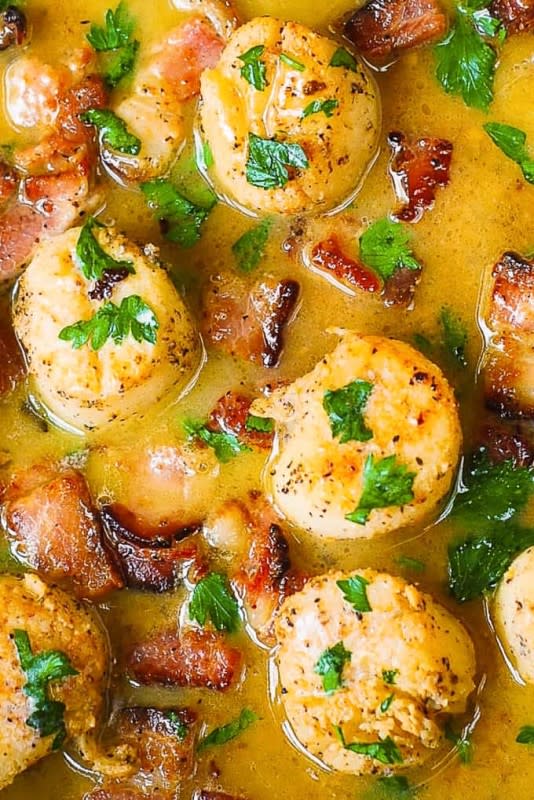 <p>Julia's Album</p><p>Bacon scallops with lemon butter sauce—this dish tastes just like bacon-wrapped scallops but is much easier to make! It takes only 30 minutes from start to finish!</p><p><strong>Get the recipe: <a href="https://juliasalbum.com/seared-scallops-with-bacon-in-lemon-butter-sauce/" rel="nofollow noopener" target="_blank" data-ylk="slk:Seared Scallops with Bacon in Lemon Butter Sauce;elm:context_link;itc:0;sec:content-canvas" class="link rapid-noclick-resp">Seared Scallops with Bacon in Lemon Butter Sauce</a></strong></p>