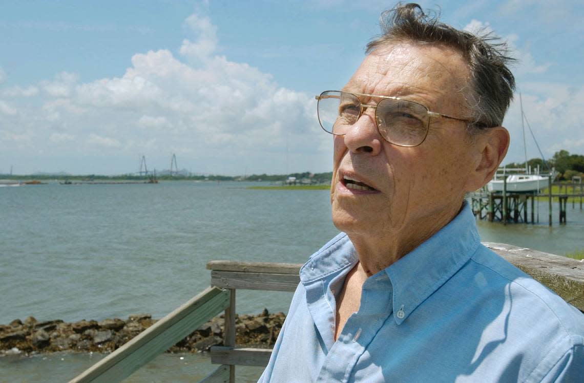 FILE - Sen. Arthur Ravenel, R-Mount Pleasant, sits at the end of the dock of his house in Mount Pleasant,S.C., and talks about his career in South Carolina politics on July 28, 2004. Ravenel, the former congressman and state lawmaker who helped build the Republican Party in South Carolina and get money for the graceful bridge that dominates the Charleston skyline and bears his name, died Monday, Jan. 16, 2023, his family announced in a short statement. He was 95. (AP Photo/Lou Krasky, File)