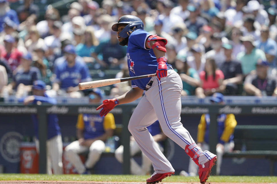 Toronto Blue Jays' Vladimir Guerrero Jr. watches after lining out to left field during the first inning of a baseball game against the Seattle Mariners, Sunday, July 10, 2022, in Seattle. (AP Photo/Ted S. Warren)