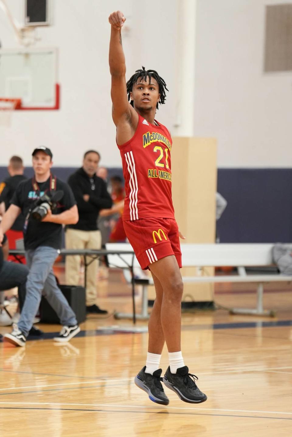 DJ Wagner holds his follow through after shooting a ball during practice ahead of the 2023 McDonald’s All-American Game in Houston, Texas.