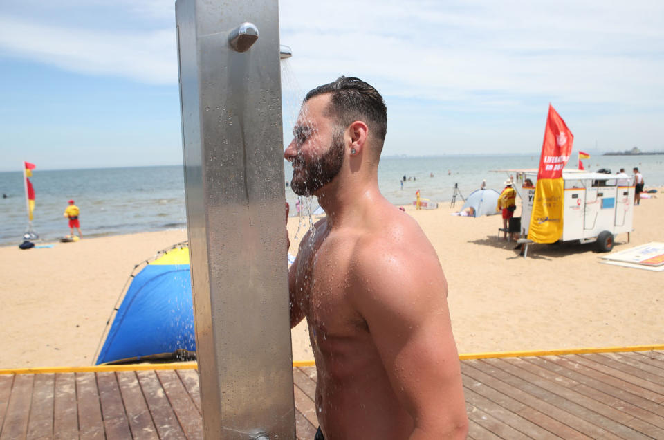 A man cools off at St Kilda beach in Melbourne. Source: AAP