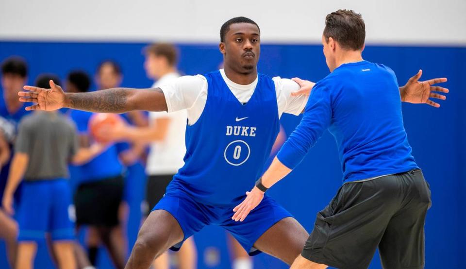 Duke trainer Nick Potter works with freshman Dariq Whitehead (0) during the Blue Devils’ practice on Tuesday, September 27, 2022 in Durham, N.C. Whitehead is recovering from a fractured foot that required surgery in August.