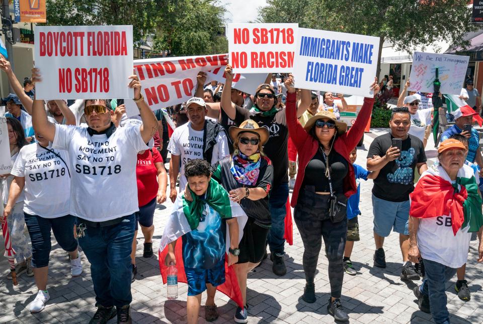  Marchers protest the new controversial immigration law, SB 1718, that was signed into law by Florida Governor Ron DeSantis. Hundreds gathered and marched in downtown West Palm Beach, Florida on June 1, 2023.