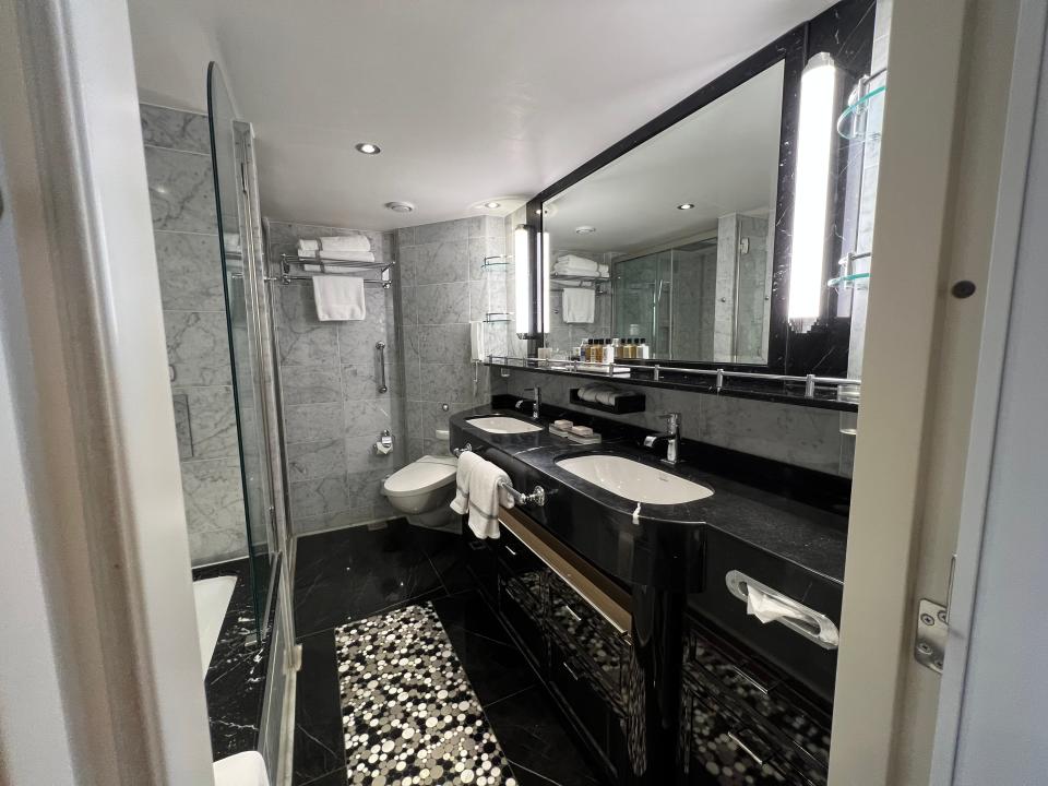 a view of the bathroom with black counter