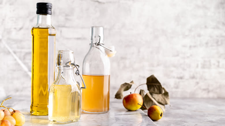 Bottles of vinegar with fruit