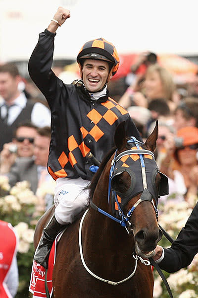 <p>Jockey Corey Brown riding Shocking celebrates after winning the 2009 Melbourne Cup</p>