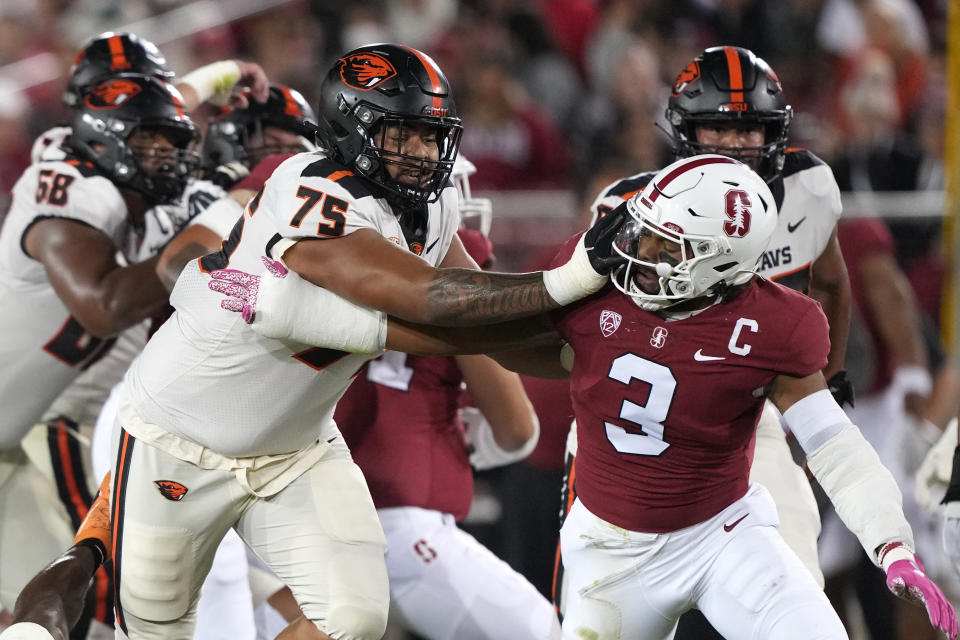 Oct 8, 2022; Stanford, California, USA; Oregon State Beavers offensive lineman Taliese Fuaga (75) blocks Stanford Cardinal linebacker Levani Damuni (3) during the first quarter at Stanford Stadium. Mandatory Credit: Darren Yamashita-USA TODAY Sports