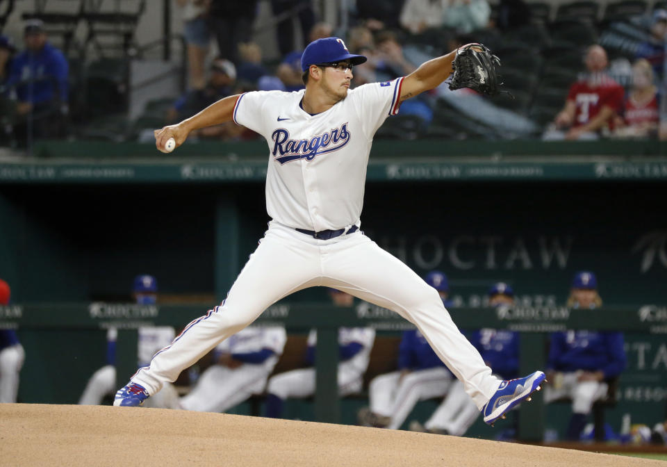 Texas Rangers starting pitcher Dane Dunning delivers to the plate against the Baltimore Orioles during the first inning of a baseball game in Arlington, Texas, Saturday, April 17, 2021. (AP Photo/Ray Carlin)