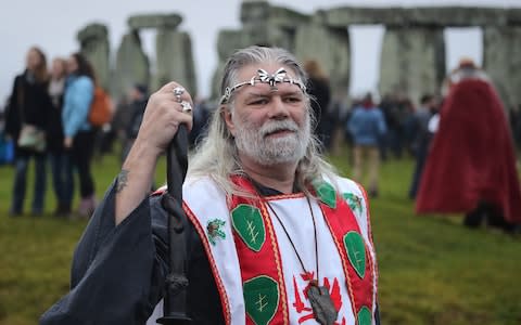 Arthur Pendragon poses as Druids, pagans and revellers gather in the centre of Stonehenge, hoping to see the sun rise, as they take part in a winter solstice ceremony - Credit: Matt Cardy/Getty Images