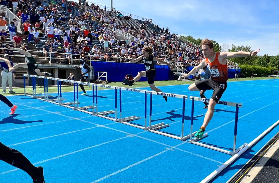 Freeport hurdler Bayley Pierce, right, heads down the final stretch during the 300-meter hurdles race in the Class 2A state championships at Charleston on Saturday, May 28, 2022.