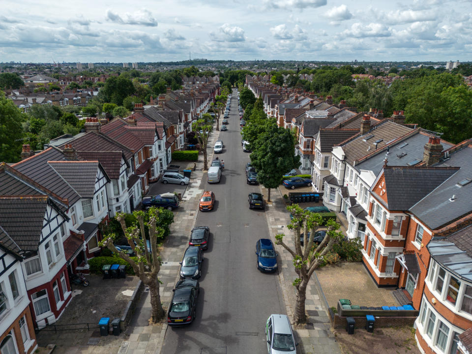 house prices ENFIELD, ENGLAND - JUNE 26: An aerial view of residential properties are pictured on June 26, 2023 in Enfield, England. According to data from the Financial Conduct Authority (FCA), borrowers in the London Borough of Enfield have the biggest mortgages relative to their income in the UK. With nearly two thirds borrowing at least four times their household income, leaving them likely to be affected by significant rises in monthly payments as interest rates continue to rise to counter stubborn inflation. (Photo by Carl Court/Getty Images)