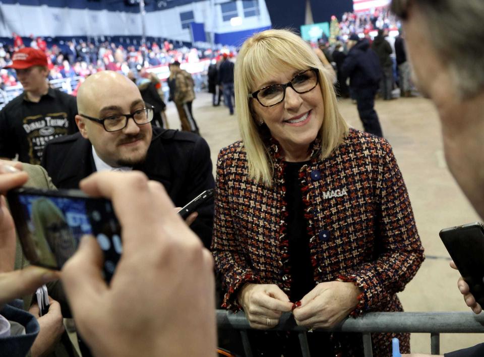 Laura Cox, the chairperson of the Michigan Republican Party, talks with members of the media roughly three hours before President Donald Trump was to appear at his Merry Christmas Rally at Kellogg Arena in Battle Creek, Mich., on Dec. 18, 2019.