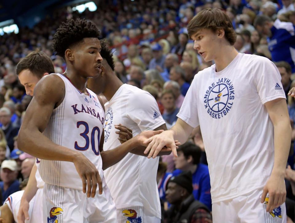 Zach Clemence (right) congratulates Ochai Agbaji (left) during Kansas' win Dec. 11, 2021 against Missouri.