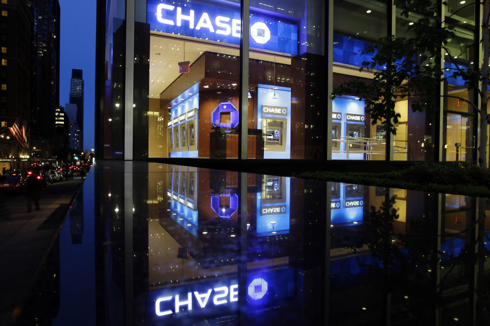 Automobiles pass a JP Morgan Chase building Thursday, May 10, 2012, in New York. JPMorgan Chase, the largest bank in the United States, said Thursday that it lost $2 billion in the past six weeks in a trading portfolio designed to hedge against risks the company takes with its own money. The company's stock plunged almost 7 percent in after-hours trading after the loss was announced. Other bank stocks, including Citigroup and Bank of America, suffered heavy losses as well. (AP Photo/Frank Franklin II)