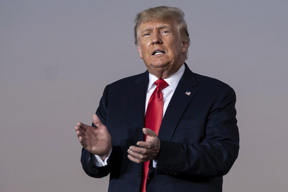 FILE - Former President Donald Trump prepares to take the stage during a rally in Perry, Ga., on Sept. 25, 2021. The New York attorney general’s office says its civil investigation has uncovered evidence that Trump's company used “fraudulent or misleading” asset valuations to get loans and tax benefits. In a court filing late Tuesday, Jan. 18, 2022, Attorney General Letitia James’ office said evidence showed that the Trump Organization routinely misrepresented the value of its properties and golf clubs in financial statements. (AP Photo/Ben Gray, File)