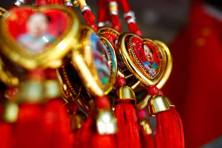 Souvenirs featuring portraits of China's late Chairman Mao Zedong are seen at a souvenir shop near the Forbidden City in Beijing, China, on the 40th anniversary of his death September 9, 2016. REUTERS/Thomas Peter