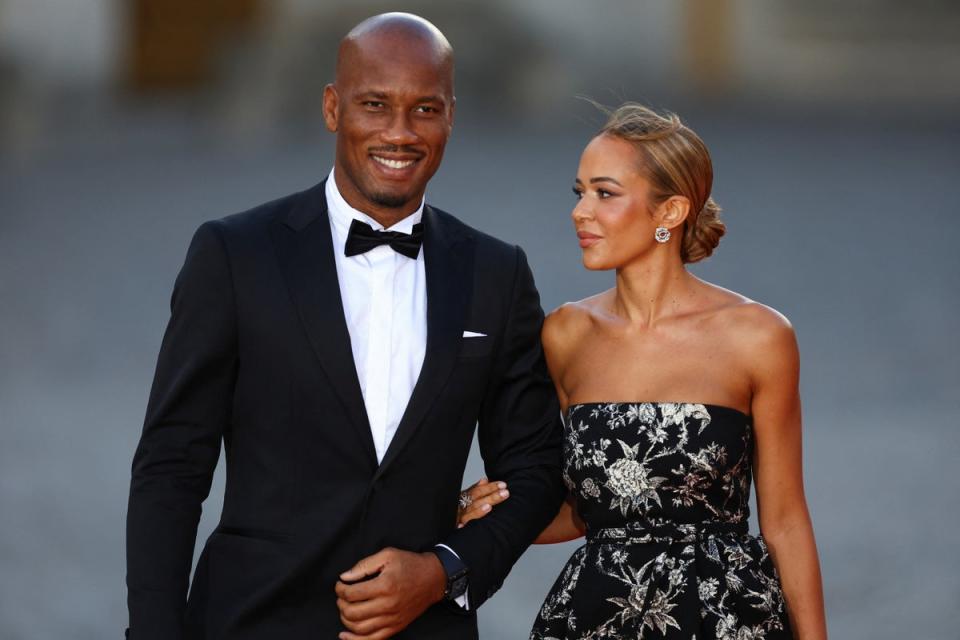 Didier Drogba and Gabrielle Lemaire arrive to attend a state dinner in honor of Britain's King Charles and Queen Camilla at the Chateau de Versailles (Reuters)