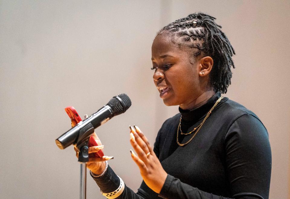 Santaluces High School student Georgena Elma reads one of her poems during Juneteenth Community Day at the Norton Museum of Art on Saturday,