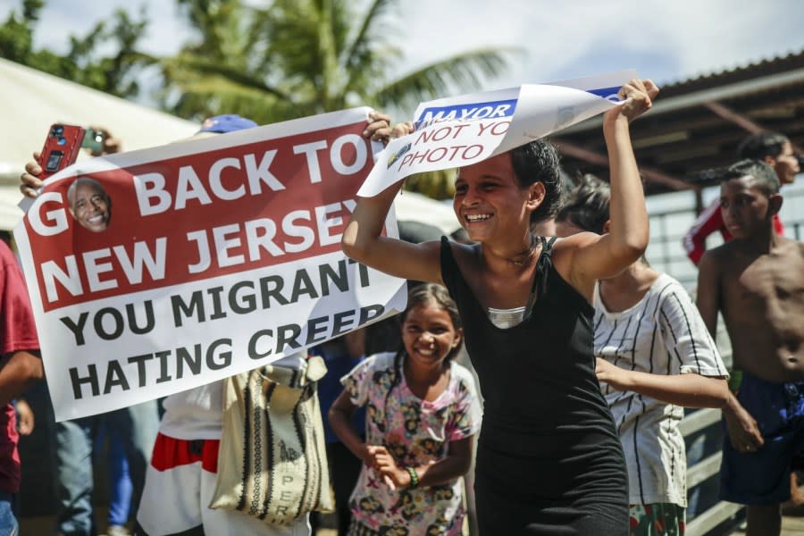 Migrants protest during the visit of New York City Mayor Eric Adams to Necocli, northern Colombia, Saturday, Oct. 7, 2023. (AP Photo/Ivan Valencia)