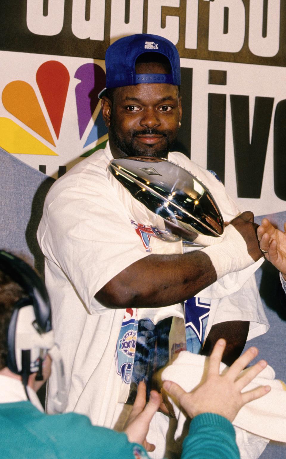 Emmitt Smith holds the Lombardi Trophy after the Cowboys' victory in Super Bowl 28 in January 1994.