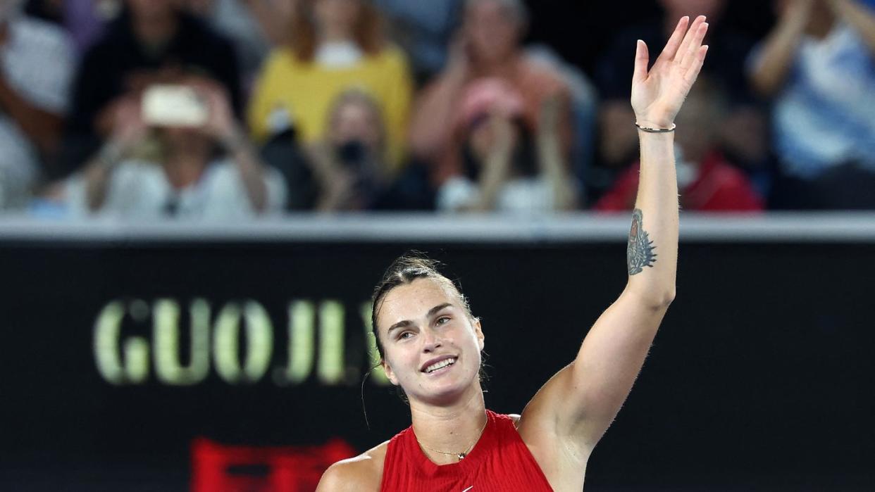 aryna sabalenka waving to the crowd at the australian open 2024