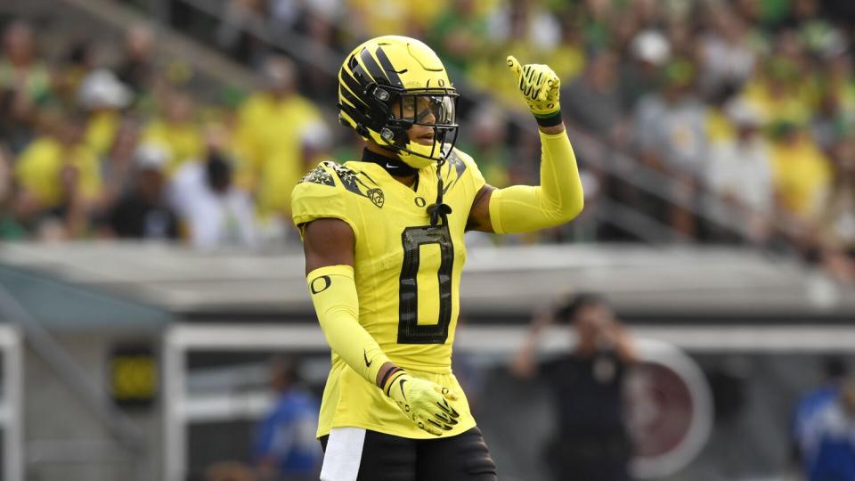 Oregon cornerback Christian Gonzalez checks on defensive calls.